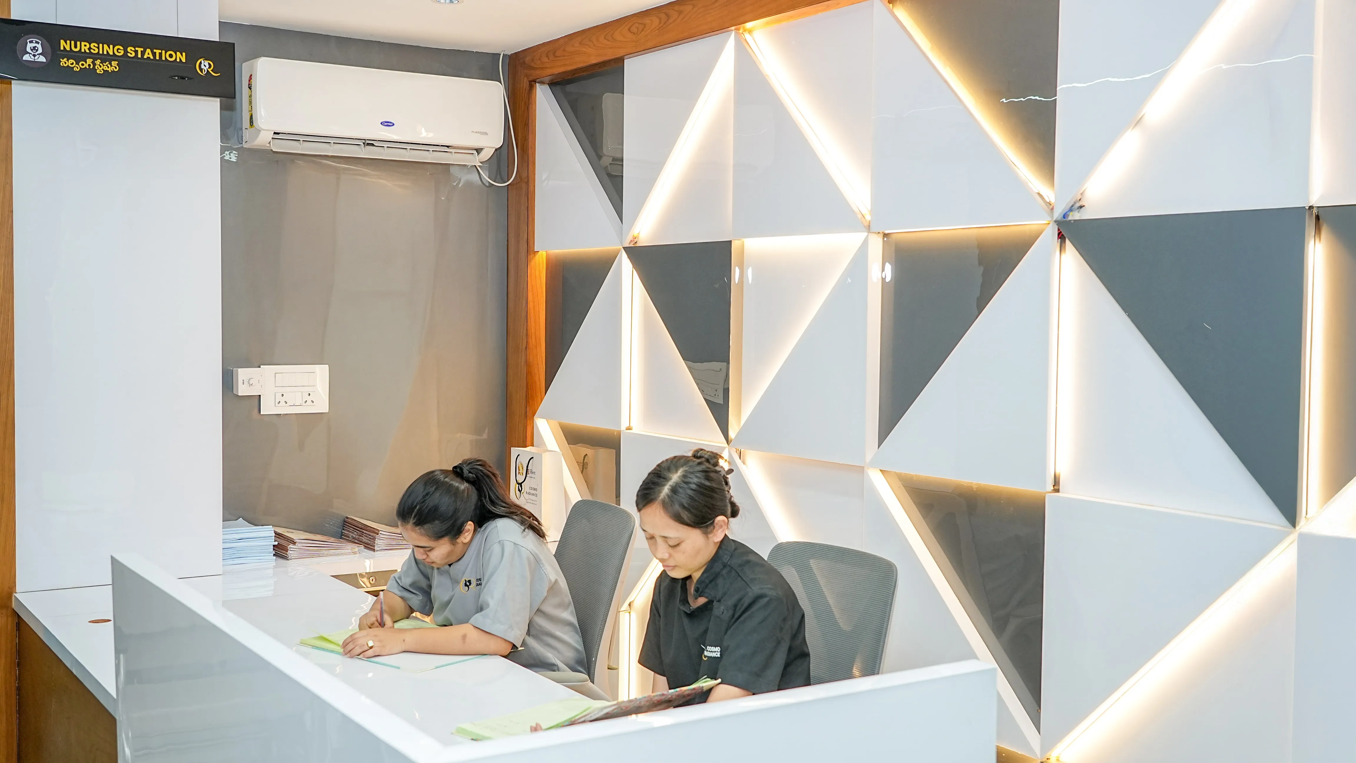 Central nursing station staffed by professionals with crash carts