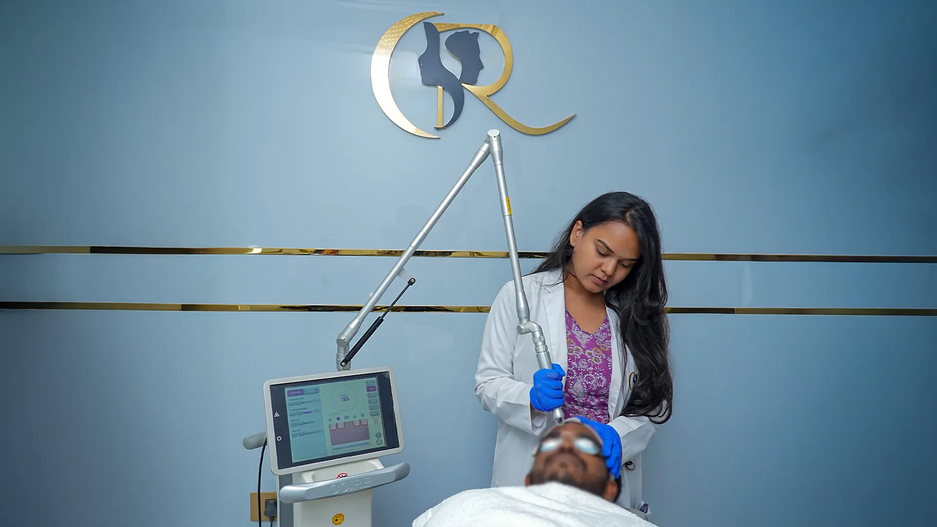 Dermatologist performing fractional CO2 laser resurfacing