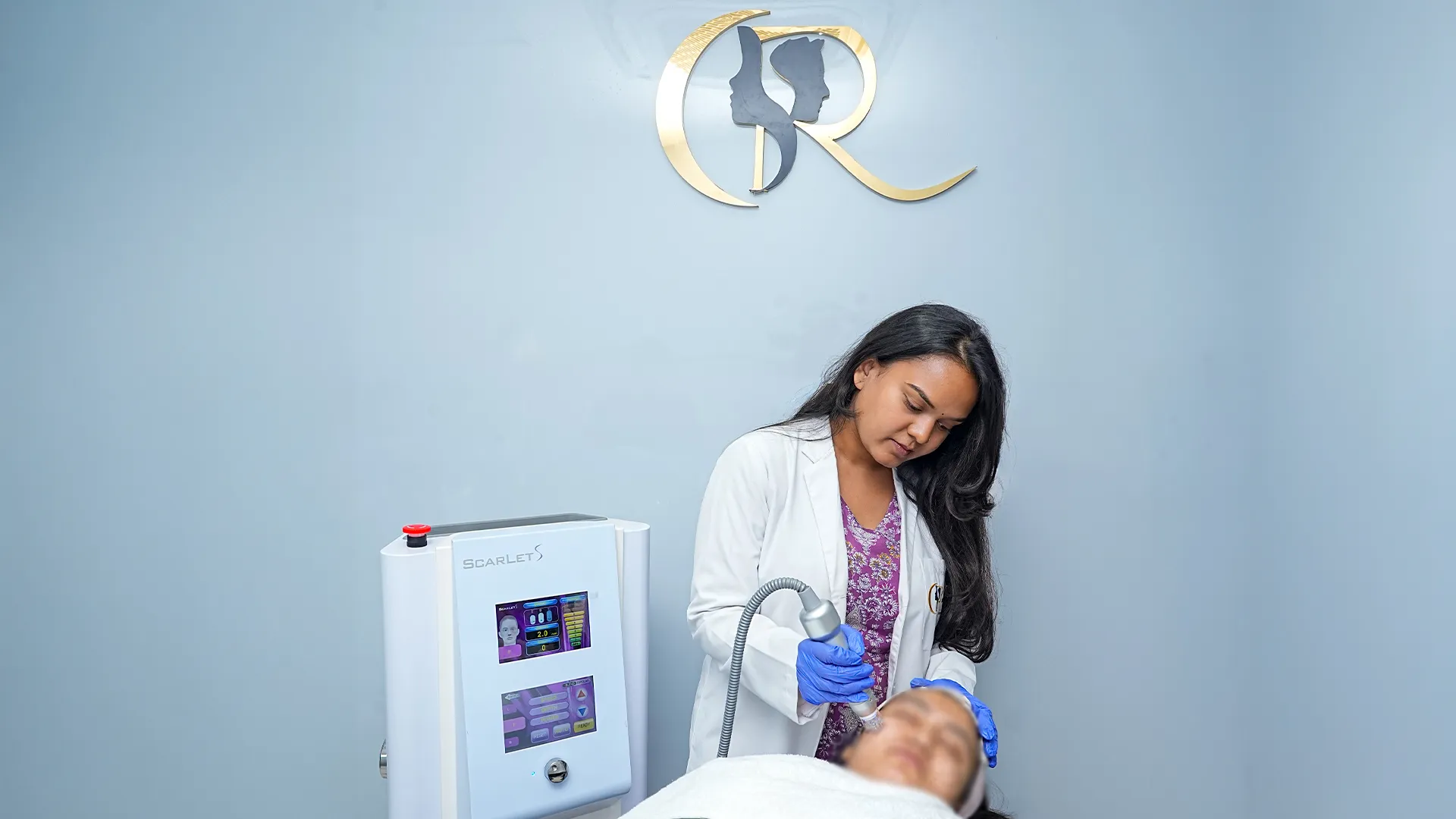 Dermatologist performing Scarlet S MNRF skin tightening procedure