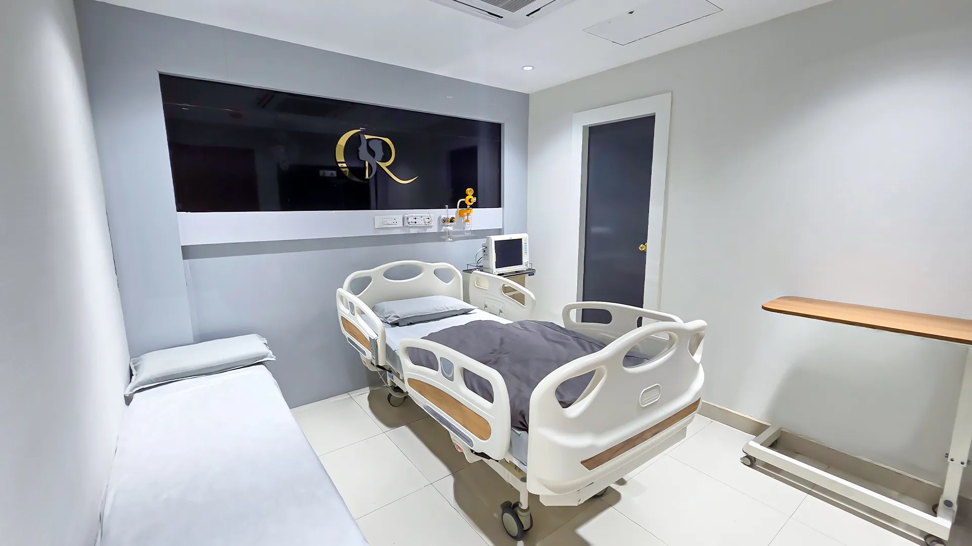 Spacious patient suite interior with marble wall finishes